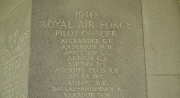 Inscribed stone memorial panel from 1940 listing names of Royal Air Force Pilot Officers who died in service, including ALEXANDER E.H., located at the Air Forces Memorial in Runnymede